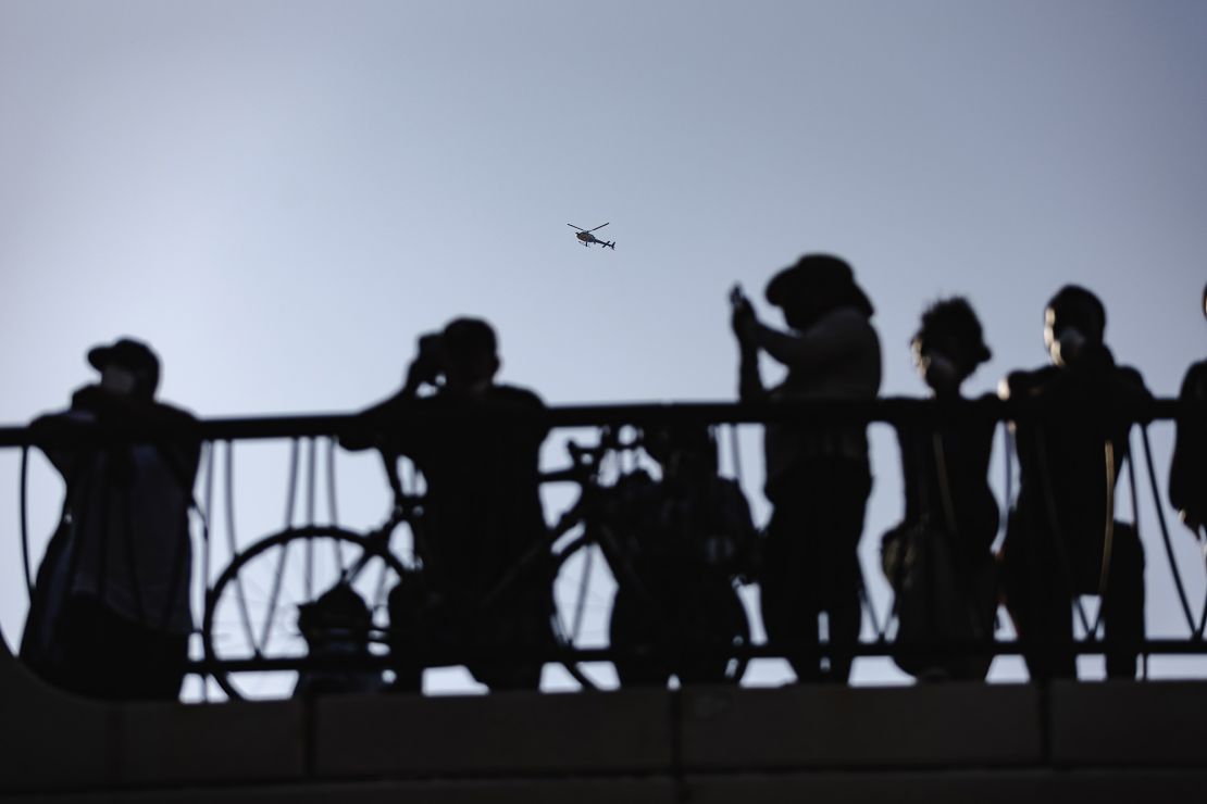 A police helicopter hovers over protesters outside of the Robert Young Federal Building on June 9 in downtown Los Angeles.