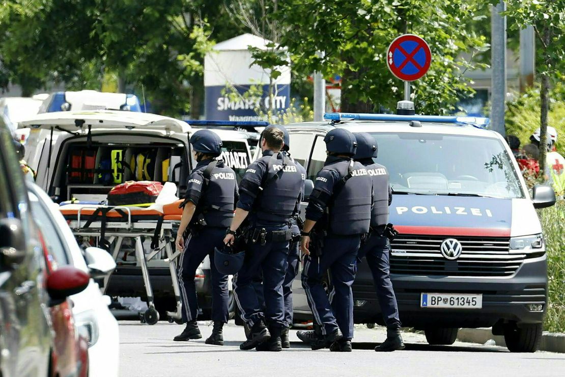 Police officers in a street close to the school on June 10.