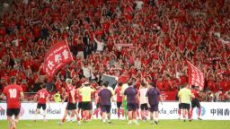 Team Hong Kong fans cheer from the stands after the AFC Asian Cup 2027 Qualifier third round Group C match between Hong Kong and India at Kai Tak Stadium in Hong Kong on June 10, 2025.
