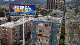 An aerial view shows a billboard reading "Strength Miguel" in  of Senator Miguel Uribe Turbay, who was shot and wounded during a political event on Saturday, in Bogota, on June 10, 2025. Right-wing senator and presidential candidate Miguel Uribe is in intensive care, and his condition is stable but critical, according to the latest medical report. (Photo by Raul ARBOLEDA / AFP) (Photo by RAUL ARBOLEDA/AFP via Getty Images)          