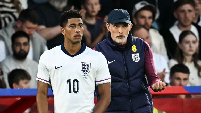 England's head coach Thomas Tuchel, right, speaks to midfielder Jude Bellingham as he prepares to enter the pitch during the international friendly football match between England and Senegal at the City Ground stadium, in Nottingham, England, on June 10, 2025.