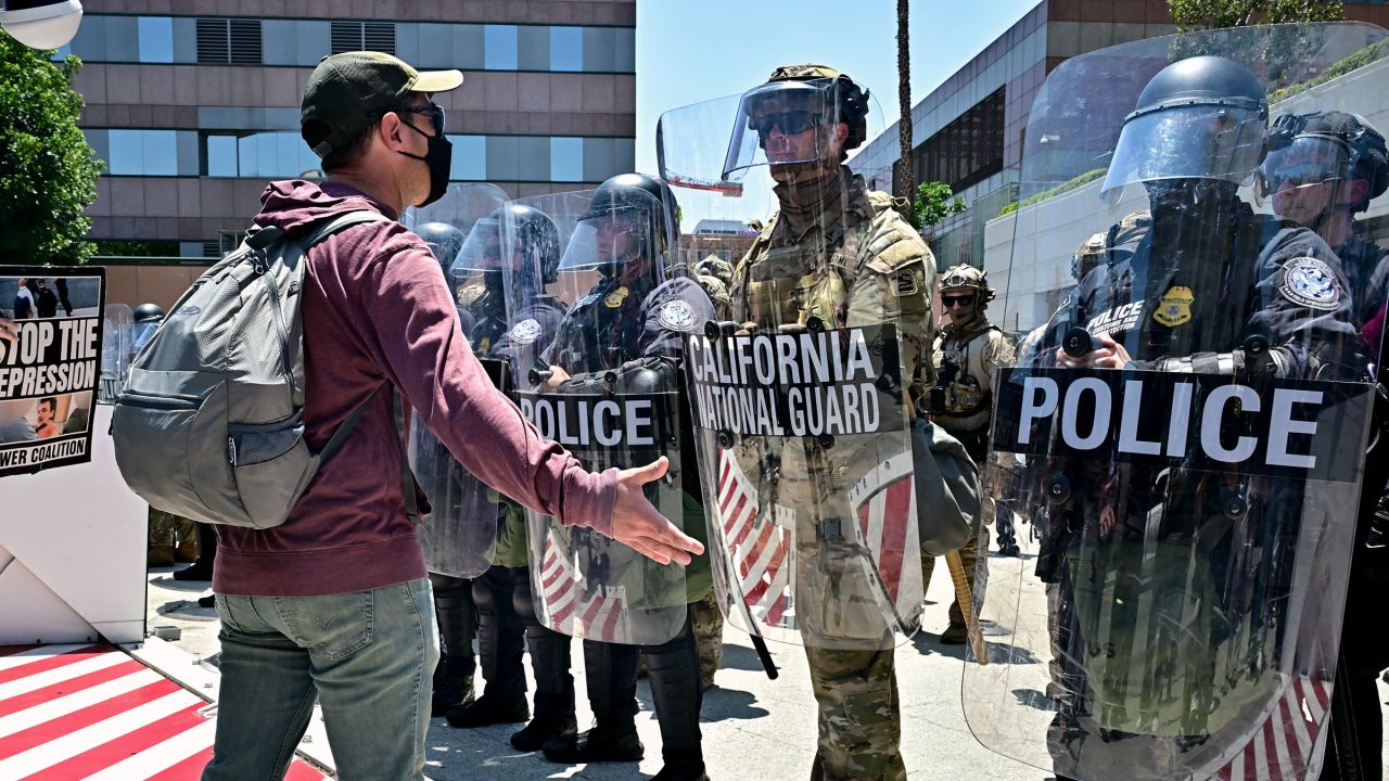 Protesters face members of the California National Guard and US Customs and Border Protection agents holding up shields outside the Federal Building as people continue to protest in response to federal immigration operations in Los Angeles, on June 10, 2025. Hundreds of Marines are due to arrive in Los Angeles on June 10 after US President Donald Trump ordered their deployment in response to protests against immigration arrests and despite objections by state officials. The 700 troops will join National Guard soldiers, amping up the militarization of the tense situation in the sprawling city, which is home to millions of foreign-born and Latino residents. The unrest was sparked by a sudden intensification of Trump's signature campaign to deport illegal migrants, with raids conducted on workplaces. (Photo by Frederic J. Brown / AFP) (Photo by FREDERIC J. BROWN/AFP via Getty Images)          