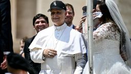 Pope Leo XIV (C) reacts wearing a Chicago White Sox baseball team cap as he meets newly wedded couples during the weekly general audience in St Peter's Square at the Vatican on June 11, 2025. (Photo by Filippo MONTEFORTE / AFP) (Photo by FILIPPO MONTEFORTE/AFP via Getty Images)          