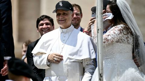 Pope Leo XIV (C) reacts wearing a Chicago White Sox baseball team cap as he meets newly wedded couples during the weekly general audience in St Peter's Square at the Vatican on June 11, 2025. (Photo by Filippo MONTEFORTE / AFP) (Photo by FILIPPO MONTEFORTE/AFP via Getty Images)          