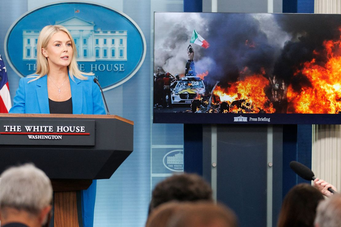 Flanked by images from ICE protests in Los Angeles, White House press secretary Karoline Leavitt speaks about President Donald Trump's response to the protests during a press briefing on Wednesday, June 11, 2025, at the White House in Washington, DC.