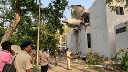 The back of Air India flight 171 is pictured at the site after it crashed in a residential area near the airport in Ahmedabad on June 12, 2025. A London-bound passenger plane crashed in the Indian city of Ahmedabad on June 12 and all 242 people on board were believed killed, with the jet smashing into buildings housing doctors and their families.