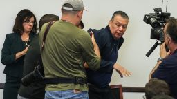 TOPSHOT - US Senator Alex Padilla, Democrat from California, is removed from the room after interrupting a news conference with Department of Homeland Security Secretary Kristi Noem at the Wilshire Federal Building in Los Angeles on June 12, 2025. US President Donald Trump said Thursday that Los Angeles was "safe and sound" for the past two nights, crediting his deployment of thousands of troops to quell anti-deportation protests, as California prepared for a legal showdown over his unprecedented move. With protests spreading across the United States, a night-time curfew has been in place in its second-largest city with authorities tackling vandalism and looting that scarred a few city blocks. (Photo by Patrick T. Fallon / AFP) / ALTERNATE CROP (Photo by PATRICK T. FALLON/AFP via Getty Images)          