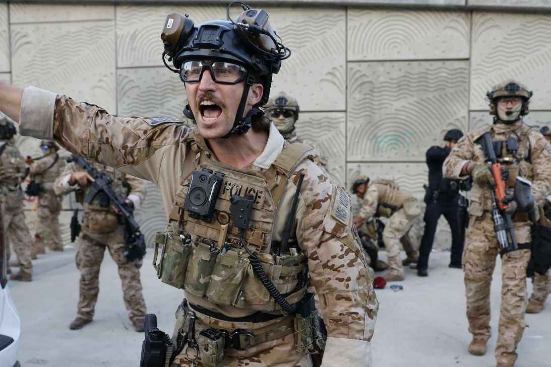 Members of the California National Guard detain a protester at the Edward R. Roybal Federal Building in downtown Los Angeles, on June 12.