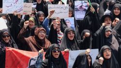 People gather for a protest against Israel's wave of strikes on Iran in central Tehran on June 13, 2025. Israel hit about 100 targets in Iran on June 13, including nuclear facilities and military command centres and killing senior figures including the armed forces chief and top nuclear scientists. (Photo by ATTA KENARE / AFP) (Photo by ATTA KENARE/AFP via Getty Images)