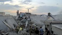 People and first-responders gather atop a building that was hit by an Israeli strike in Tehran on June 13, 2025. Israel hit about 100 targets in Iran on June 13, including nuclear facilities and military command centres and killing senior figures including the armed forces chief and top nuclear scientists. (Photo by MEGHDAD MADADI / TASNIM NEWS / AFP) (Photo by MEGHDAD MADADI/TASNIM NEWS/AFP via Getty Images)