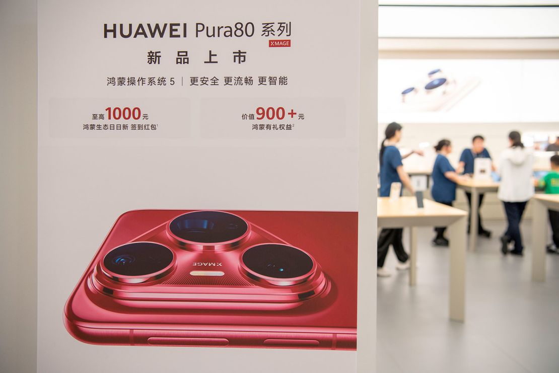 Customers shop in a Huawei store in Haian City in China's Jiangsu province in June.