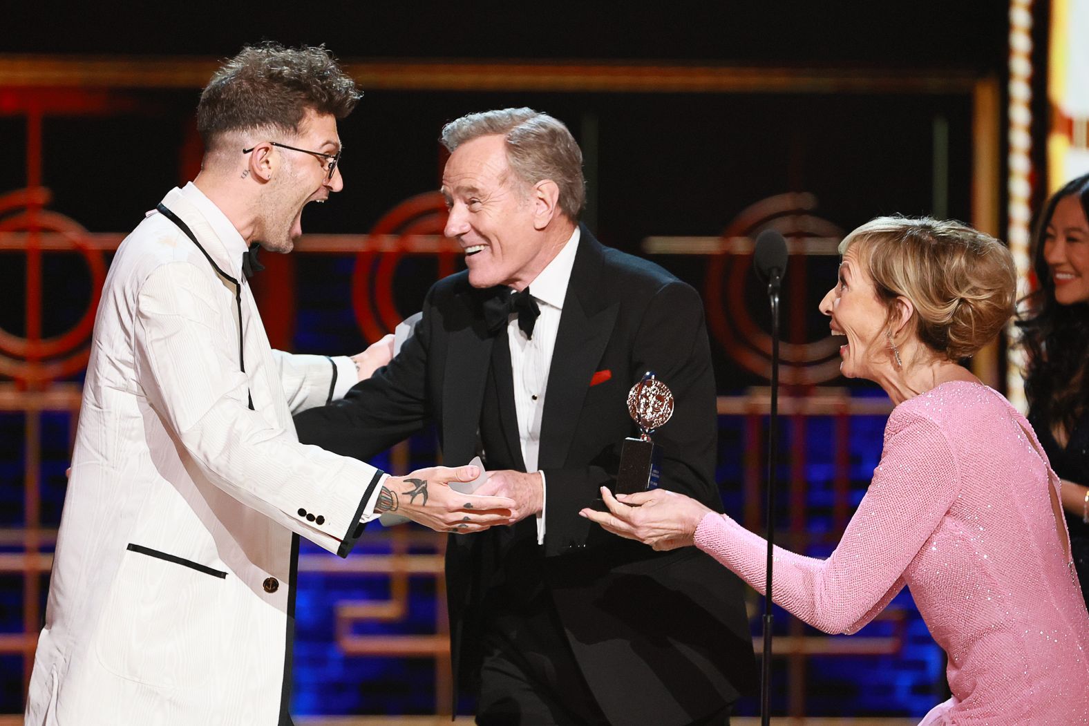 Sam Pinkleton accepts the best direction of a play award for "Oh, Mary!" from Bryan Cranston and Allison Janney.