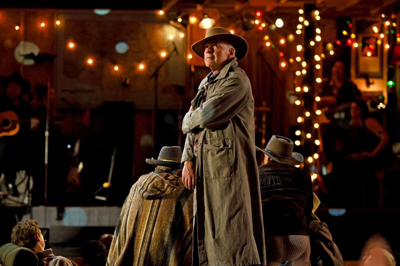 Ken Marks and the cast of "Dead Outlaw" perform onstage.