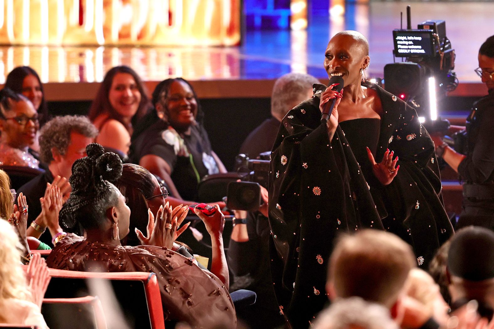 Erivo jokingly presents Oprah Winfrey with a toy car in between awards and performances.