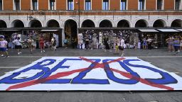 TOPSHOT - People gather to protest against the wedding of Amazon Founder and CEO Jeff Bezos and journalist Lauren Sanchez in Venice, on June 13, 2025. Poster campaigns and stickers have spread throughout the city, including one with images of Bezos reading "No space for Bezos" as some local residents protest claiming the city is transformed into a playground for billionaires. (Photo by ANDREA PATTARO / AFP) (Photo by ANDREA PATTARO/AFP via Getty Images)          