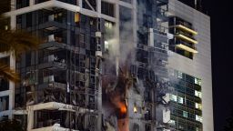 Fire and smoke rise from a building, reportedly hit by a missile fired from Iran, in central Tel Aviv on June 13, 2025. Iran fired a barrage of ballistic missiles at Israel in a counter-strike in the evening on June 13, after an unprecedented onslaught hammered the Islamic republic's top military brass and targeted its nuclear facilities and bases. (Photo by Jack GUEZ / AFP) (Photo by JACK GUEZ/AFP via Getty Images)          