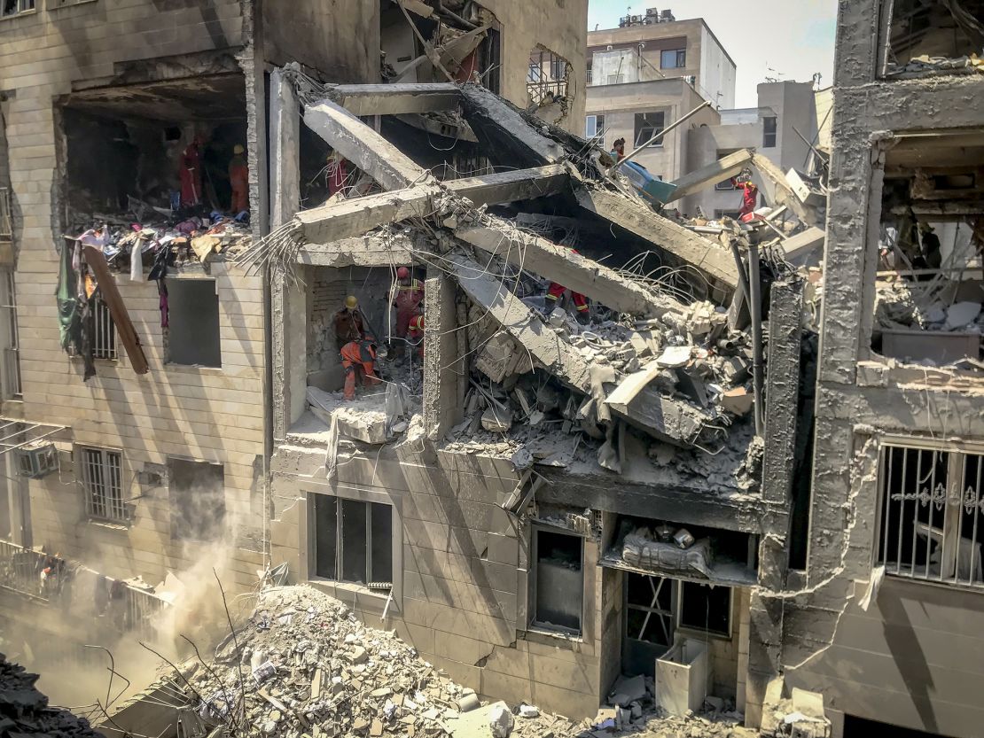 Photo from inside a house across a targeted residential building shows extensive damage in Tehran, Iran, on June 13.