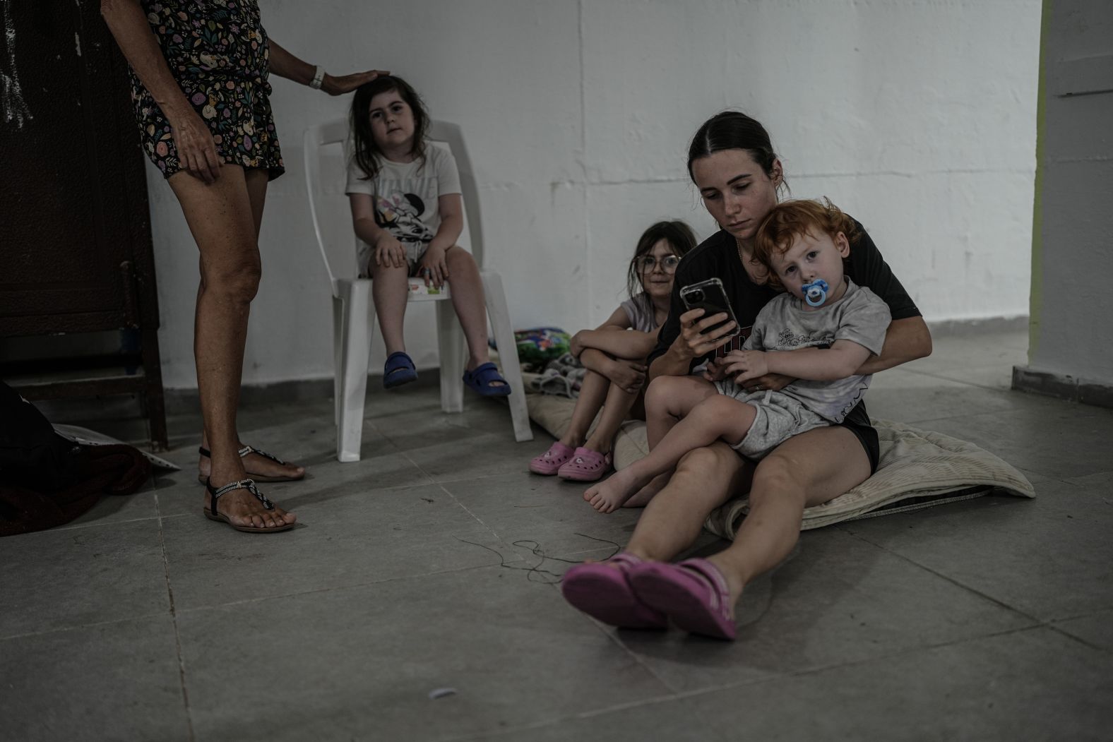 Families shelter in bunkers in Ashkelon, Israel, on Friday.