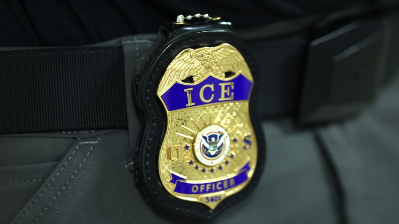NEW YORK, NEW YORK - JUNE 09: The badge of an  Immigration and Customs Enforcement (ICE) agent is seen as they patrol the halls of immigration court at the Jacob K. Javitz Federal Building on June 09, 2025 in New York City. Federal agents are arresting immigrants during mandatory check-ins, as ICE ramps up enforcement following immigration court hearings. The Trump administration has ordered officials to increase detentions to 3,000 migrants per day. (Photo by Michael M. Santiago/Getty Images)