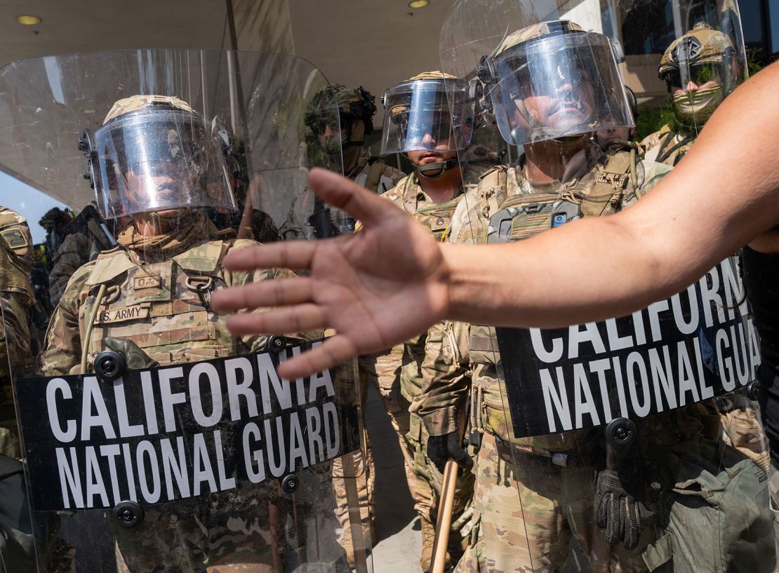 Protesters confront National Guard soldiers and police outside a federal building as protests continue in Los Angeles following three days of clashes with police after a series of immigration raids, on June 9, 2025