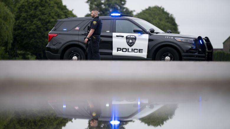 BROOKLYN PARK, MINNESOTA - JUNE 14: A Brooklyn Park police officer looks on as they guard the entrance to a neighborhood on June 14, 2025 in Brooklyn Park, Minnesota. Democratic-Farmer-Labor State Rep. Melissa Hortman and her husband were shot and killed this morning. Democratic-Farmer-Labor State Sen. John Hoffman and his wife were also shot and hospitalized in a separate incident. Minnesota Gov. Tim Walz said during a press conference that the shooting "appears to be a politically motivated assassination." (Photo by Stephen Maturen/Getty Images)