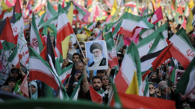 TEHRAN, IRAN  JUNE 14: Demonstrators take part in anti-Israel and anti-U.S. demonstrations after Ghadir Khumm celebrations turned into protest marches in response to Israeli attacks on June 14, 2025, in Tehran, Iran. Marchers gathered at Enghelab Square after walking from Azadi and Imam Hussein Squares, chanting slogans such as "Revenge, revenge," and calling for stronger retaliation against Israel. Protesters held Iranian flags and carried posters of Supreme Leader Ayatollah Ali Khamenei. (Photo by Fatemeh Bahrami/Anadolu via Getty Images)
