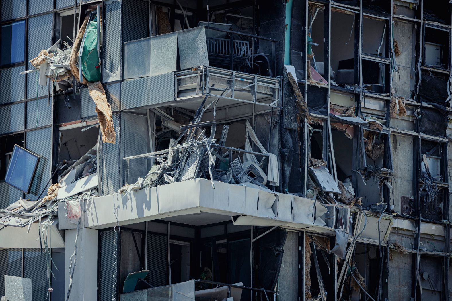 Shattered windows and structural damage are seen in Rishon Lezion on Saturday.