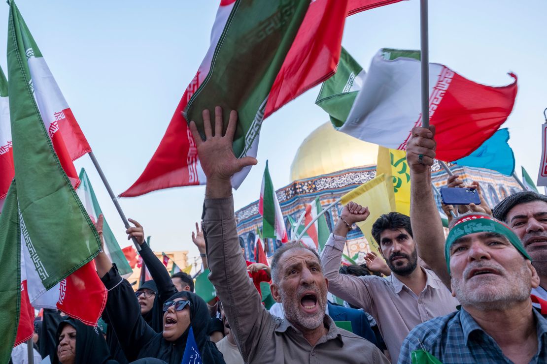 Iranians shout anti-US and anti-Israeli slogans as they gather in Tehran, Iran, on June 14, 2025, during a religious rally to condemn Israeli attacks.
