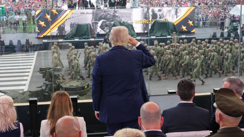 WASHINGTON, DC - JUNE 14: President Donald Trump stands and salutes troops during the celebration of the Army's 250th birthday on the National Mall on June 14, 2025 in Washington, DC. The U.S. Army is marking its 250th anniversary with a military parade along Constitution Avenue that includes roughly 6,600 troops, 150 vehicles, and over 50 aircraft.  The parade, which coincides with President Donald Trump's 79th birthday, is designed to tell the history of the Army. (Photo by Doug Mills - Pool/Getty Images)