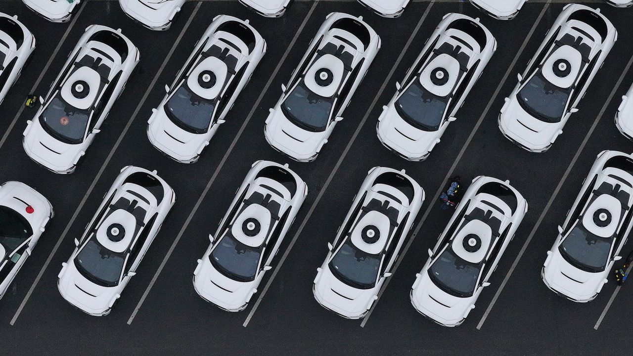 In an aerial view, Waymo cars are seen parked at a Waymo facility in San Francisco, California. Waymo is providing paid rides already in four cities, including San Francisco. It is starting tests in New York City, but not yet providing rides there.