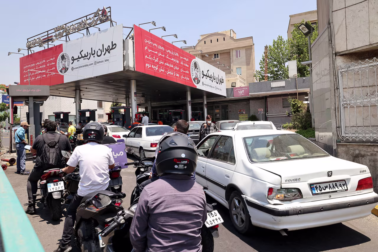 Motorists queue at a petrol station in Tehran on Sunday.