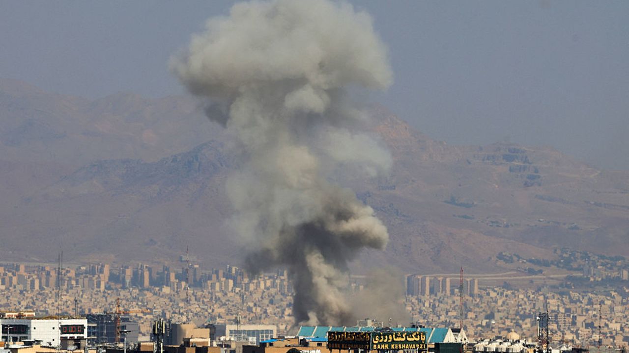 TOPSHOT - Smoke billows following an explosion in central Tehran on June 15, 2025. Iranian media said an Israeli strike hit the Tehran police headquarters in the city centre on June 15, as the two foes exchanged fire for a third day. (Photo by Atta KENARE / AFP) (Photo by ATTA KENARE/AFP via Getty Images)          