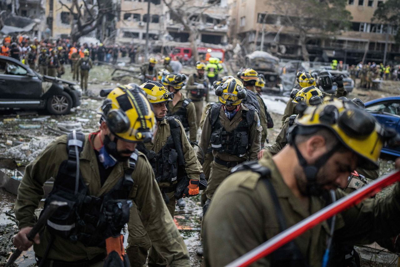 Israeli first responders enter a damaged building after an Iranian missile strike on central Tel Aviv, Israel on Monday.