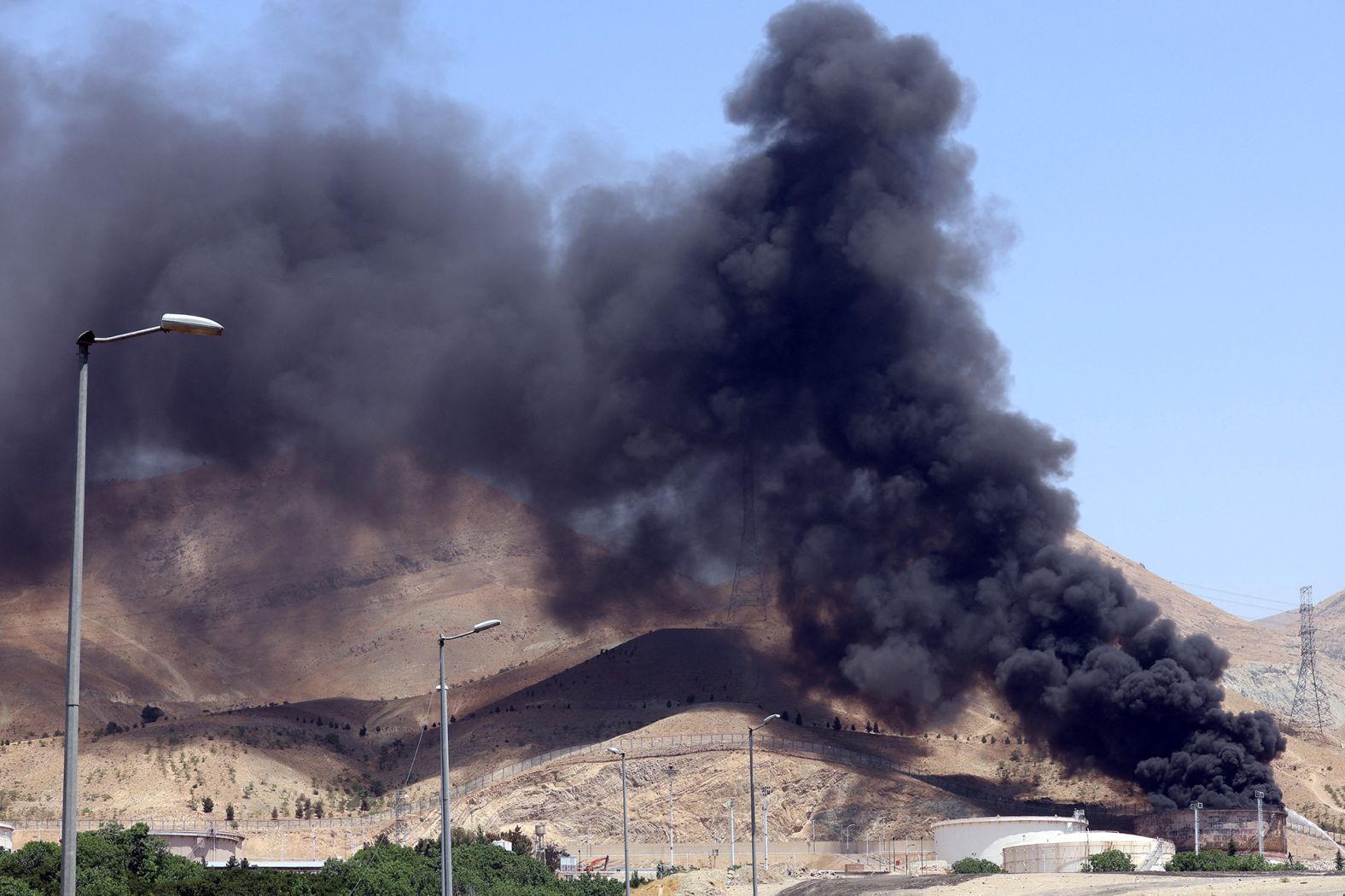 Smoke billows from the Shahran oil depot, northwest of Tehran, Iran.