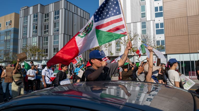 Protesters move through downtown Los Angeles on Wednesday, June 11, as demonstrations continue after a series of immigration raids.