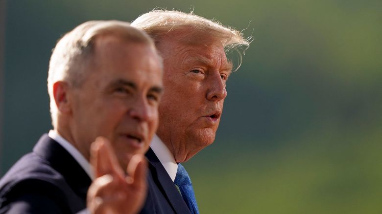 Canadian Prime Minister Mark Carney and US President Donald Trump arrive for a family photo during the G7 Summit at the Kananaskis Country Golf Course in Kananaskis, Alberta, Canada on June 16, 2025.