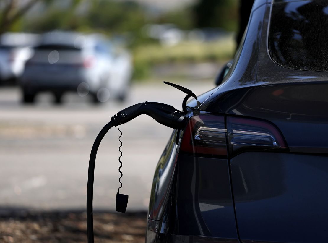 A Tesla car is parked at an electric vehicle charging station. President Donald Trump recently signed a congressional resolution barring California's electric vehicle sales mandate that requires 100% of new car and light truck sales in the state be zero-emission vehicles by 2035.