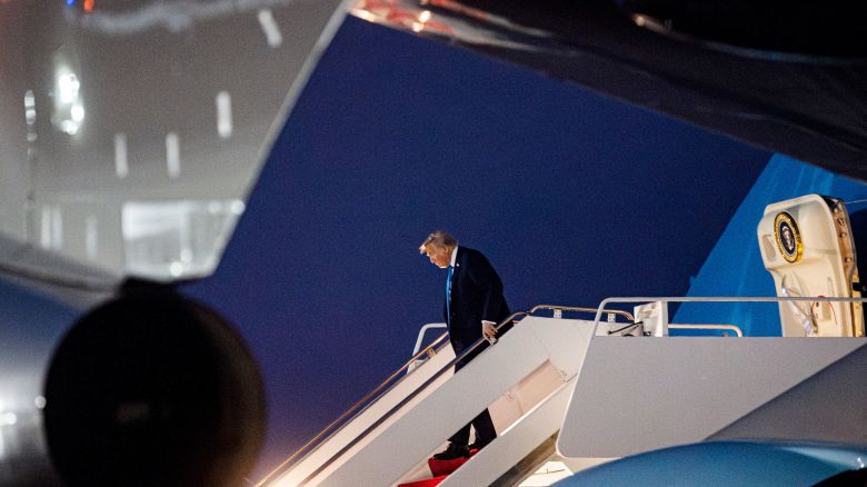 President Donald Trump alights from Air Force One after arriving at Joint Base Andrews, Maryland, on Tuesday.