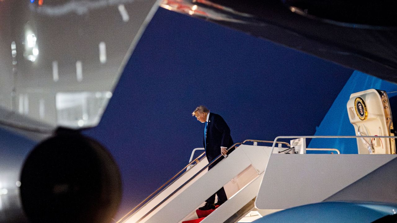President Donald Trump alights from Air Force One after arriving at Joint Base Andrews, Maryland, on Tuesday.