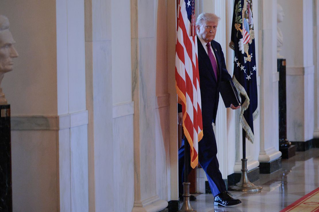 President Donald Trump arrives for an event in the East Room of the White House on June 12.