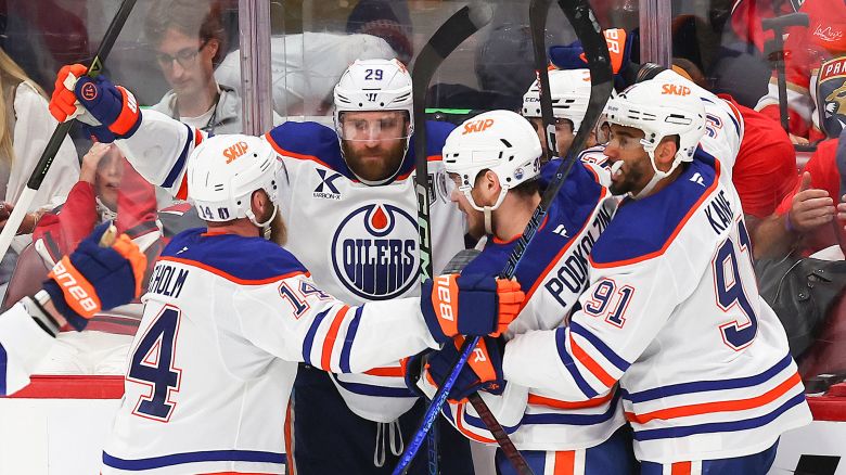 Leon Draisaitl of the Edmonton Oilers celebrates with teammates after scoring during overtime to beat the Florida Panthers 5-4 in Game Four of the 2025 Stanley Cup Final in Sunrise, Florida, on June 12, 2025.