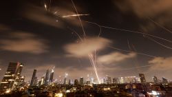 TOPSHOT - Israeli air defence systems are activated to intercept Iranian missiles over the Israeli city of Tel Aviv early on June 18, 2025. Israel and Iran exchanged fire again on June 17, the fifth day of strikes in their most intense confrontation in history, fuelling fears of a drawn-out conflict that could engulf the Middle East. (Photo by Menahem Kahana / AFP) (Photo by MENAHEM KAHANA/AFP via Getty Images)