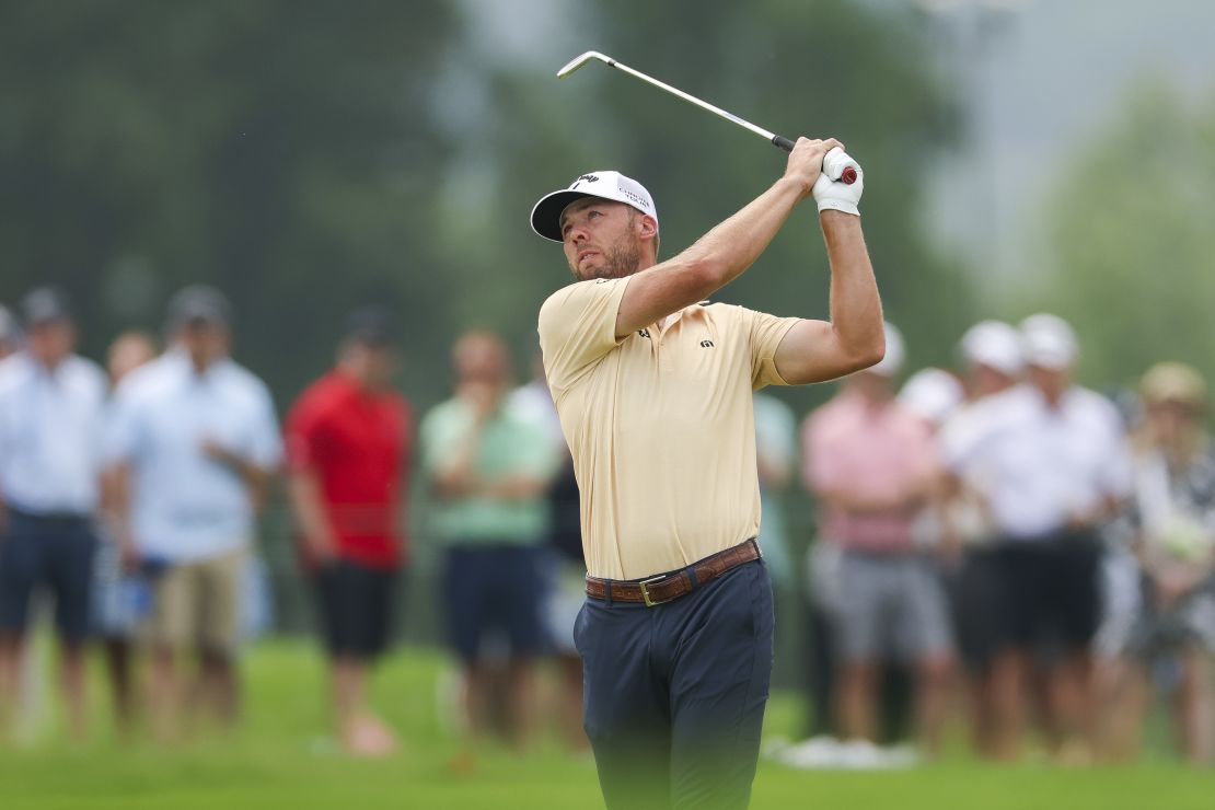 Sam Burns of the United States plays a shot on the fifth hole during the second round.