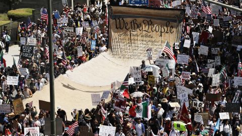 LOS ANGELES, CALIFORNIA - JUNE 14: Protesters carry a banner representing the Preamble to the U.S. Constitution in downtown Los Angeles during an anti-Trump "No Kings Day" demonstration on June 14, 2025 in Los Angeles, California. Hundreds of marches and protests against the Trump istration and its policies are happening across the United States today. Protesters are also reacting in opposition to a planned military parade celebrating the 250th anniversary of the U.S. Army that is taking place in Washington, DC and which coincides with President Trump's birthday.  (Photo by Mario Tama/Getty Images)
