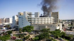 TOPSHOT - Smoke billows from a building at Soroka Hospital in Beersheba in southern Israel following an Iranian missile attack, on June 19, 2025. A hospital in southern Israel was hit during a barrage of "dozens" of Iranian missiles on June 19, officials said, while another impact was reported by emergency services in the Tel Aviv area. (Photo by AFP) (Photo by -/AFP via Getty Images)          