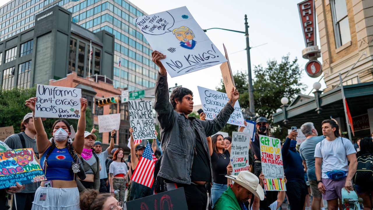 AUSTIN, TEXAS - JUNE 14: People gather in a standoff with law enforcement after marching through downtown at the conclusion of the "No Kings Day" demonstration on June 14, 2025 in Austin, Texas. Hundreds of marches and protests against the Trump administration and its policies are happening across the United States today. People are also protesting in opposition to the military parade celebrating the 250th anniversary of the U.S. Army taking place in Washington, DC. Today's parade coincides with President Trump's birthday. (Photo by Brandon Bell/Getty Images)