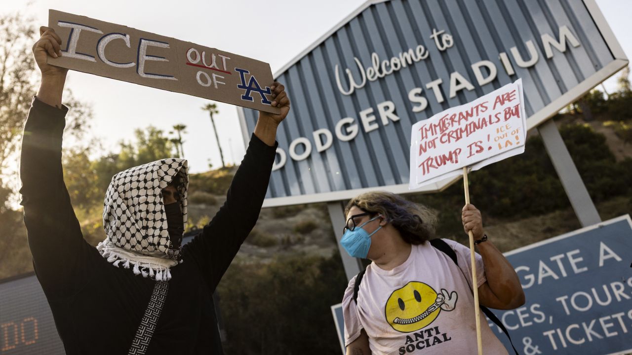 A small group of demonstrators protests outside the entrance of Dodger Stadium as the team plays tonight, claiming the organization supports federal immigration efforts, in Los Angeles, California, on June 19, 2025. Federal immigration agents were barred from entering Dodger Stadium on June 19 after requesting access to the Major League Baseball team's grounds, the team confirmed. US Immigration and Customs Enforcement (ICE) agents arrived at the stadium and "requested permission to access the parking lots," the Dodgers said in a statement. (Photo by ETIENNE LAURENT / AFP) (Photo by ETIENNE LAURENT/AFP via Getty Images)