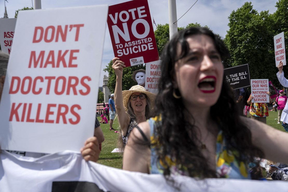Protesters against the bill outside Parliament.