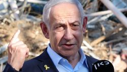 TOPSHOT - Israel's Prime Minister Benjamin Netanyahu gives a statement during a visit to the site of the Weizmann Institute of Science, which was hit by an Iranian missile barrage, in the central city of Rehovot on June 20, 2025. (Photo by Jack GUEZ / POOL / AFP) (Photo by JACK GUEZ/POOL/AFP via Getty Images)          