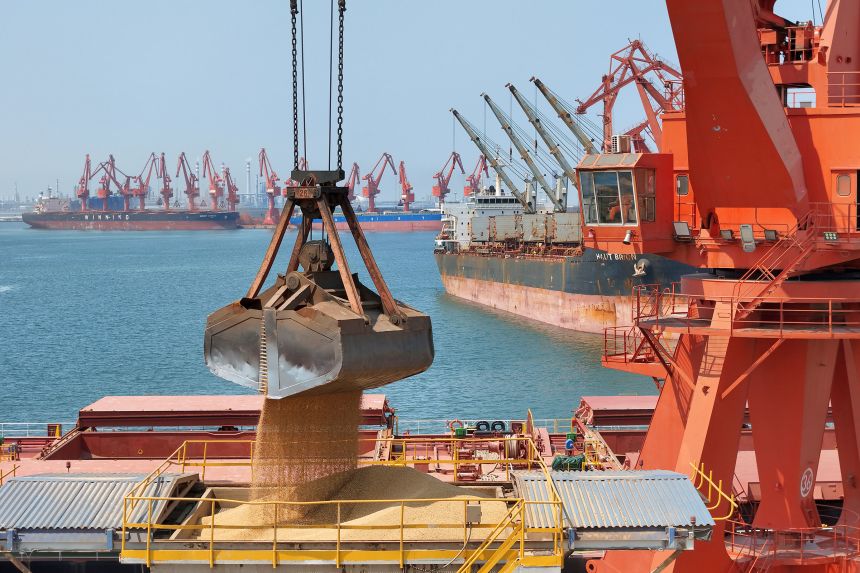 Brazilian soybeans are unloaded from a ship at Longkou Port Area of Yantai Port in the Shandong province of China, on June 17.
